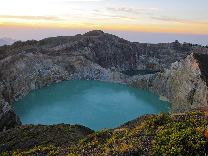 Kelimutu at sunrise over one of it's tri-coloured lakes